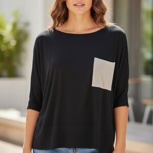 Elegant Black Top with Contrasting Cream Pocket